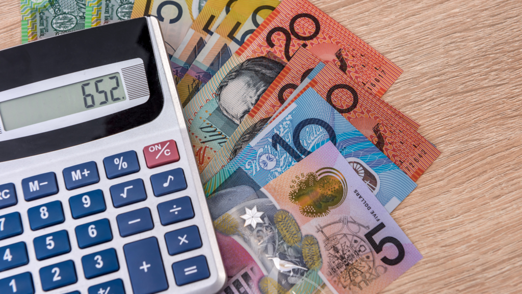 Calculator and money to signify updates on Australian Federal Budget